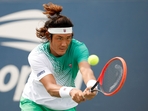 Zhizhen Zhang of China returns a shot(Getty Images via AFP) Zhizhen Zhang of China returns a shot(Getty Images via AFP)