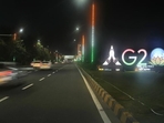 Traffics moves past an illuminated G20 logo near the airport ahead of the G20 Summit in New Delhi. (AP) Traffics moves past an illuminated G20 logo near the airport ahead of the G20 Summit in New Delhi. (AP)