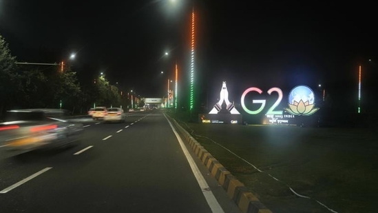 Traffics moves past an illuminated G20 logo near the airport ahead of the G20 Summit in New Delhi. (AP) Traffics moves past an illuminated G20 logo near the airport ahead of the G20 Summit in New Delhi. (AP)