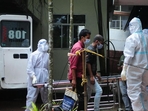 Health workers wearing protective gear shift people who have been in contact with a person infected with the Nipah virus to an isolation centre at a goverment hospital in Kozikode. (AFP) Health workers wearing protective gear shift people who have been in contact with a person infected with the Nipah virus to an isolation centre at a goverment hospital in Kozikode. (AFP)