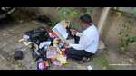 PMC official seen rummaging the trash for documents to assert the identity of the person responsible for littering. (HT PHOTO) PMC official seen rummaging the trash for documents to assert the identity of the person responsible for littering. (HT PHOTO)