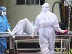 Health workers shift a man with symptoms of Nipah virus to an isolation ward at a government hospital in Kozhikode in Kerala (AFP) Health workers shift a man with symptoms of Nipah virus to an isolation ward at a government hospital in Kozhikode in Kerala (AFP)