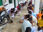 In Bihar, students write exams on roofs and verandahs; pictures go viral(Photosourced ) In Bihar, students write exams on roofs and verandahs; pictures go viral(Photosourced )