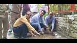 Postmaster general of Varanasi region Krishna Kumar Yadav planting sapling along with other officials on the premises of the head post office, Varanasi on Monday. (HT photo) Postmaster general of Varanasi region Krishna Kumar Yadav planting sapling along with other officials on the premises of the head post office, Varanasi on Monday. (HT photo)