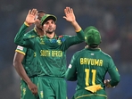 South Africa's Keshav Maharaj (C) celebrates with his team captain Temba Bavuma after their victory (AFP) South Africa's Keshav Maharaj (C) celebrates with his team captain Temba Bavuma after their victory (AFP)