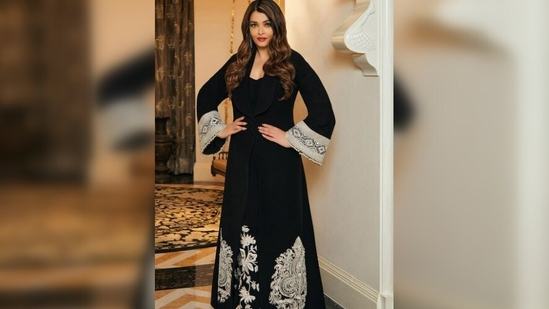 Aishwarya Rai Bachchan's attire features intricate white embroidery on both the jacket and the dress, adding to its overall elegance. (Instagram/@manishmalhotra05)