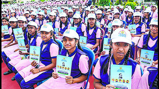 Students with copies of the preamble to the Constitution on the International Day of Democracy, in the city. The 15-member committee will frame a policy to encourage students to inculcate democratic values. (PTI) Students with copies of the preamble to the Constitution on the International Day of Democracy, in the city. The 15-member committee will frame a policy to encourage students to inculcate democratic values. (PTI)