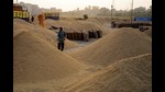 A worker segregates paddy rice at an open grain market on the outskirts of Jalandhar . (AFP) A worker segregates paddy rice at an open grain market on the outskirts of Jalandhar . (AFP)