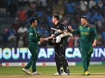 New Zealand's Matt Henry (C) greets South Africa's Quinton de Kock (L) as David Miller watches at the end of the 2023 ICC Men's Cricket World Cup one-day international (ODI) match(AFP) New Zealand's Matt Henry (C) greets South Africa's Quinton de Kock (L) as David Miller watches at the end of the 2023 ICC Men's Cricket World Cup one-day international (ODI) match(AFP)