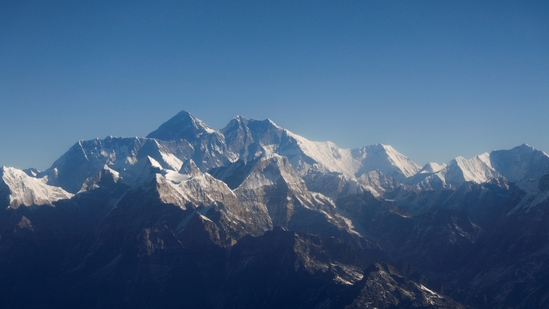 Mount Everest, the world highest peak, and other peaks of the Himalayan range are seen through an aircraft window during a mountain flight from Kathmandu, Nepal (REUTERS/Monika Deupala//File Photo)