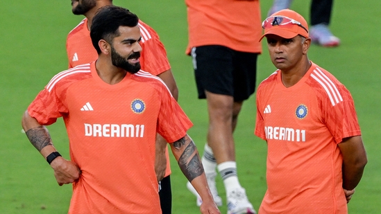 India's Virat Kohli (L) and coach Rahul Dravid interact during a practice session of a 2023 ICC Men's Cricket World Cup one-day international (ODI) match(AFP) India's Virat Kohli (L) and coach Rahul Dravid interact during a practice session of a 2023 ICC Men's Cricket World Cup one-day international (ODI) match(AFP)