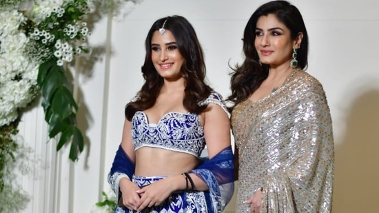 Raveena Tandon was also spotted in a silver paired with a golden blouse. She was accompanied by daughter Rasha Thadani who was in a blue and white lehenga. 
