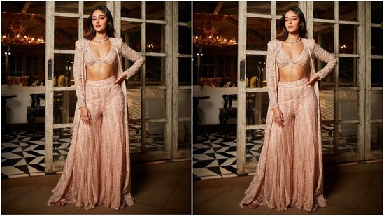 Her outfit consists of a deep V-neck bralette top, flared embellished trousers and a long gold embroidered jacket with full sleeves.(Instagram/@tanghavri)