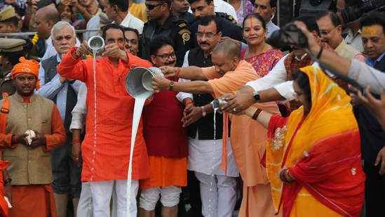 Uttar Pradesh Chief Minister Yogi Adityanath performs 'argh' during the Chhat Puja festival at Laxman Mela Ghat in Lucknow on Sunday.(Deepak Gupta/HT Photo)