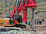 An earth-boring machine drills vertically into a mountain to rescue the 41 workers trapped in a collapsed tunnel in Silkyara in Uttarakhands on Sunday. (AFP) An earth-boring machine drills vertically into a mountain to rescue the 41 workers trapped in a collapsed tunnel in Silkyara in Uttarakhands on Sunday. (AFP)