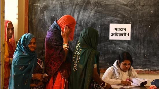 Women wait in a queue to cast their votes at a polling station during Rajasthan state assembly election in Ajmer (REUTERS) Women wait in a queue to cast their votes at a polling station during Rajasthan state assembly election in Ajmer (REUTERS)