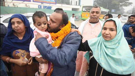 One of the workers from Bihar rescued from the tunnel in Uttarakhand, Sabah Ahmad, with his family members after his arrival at the airport in Patna on Friday. (Santosh Kumar/HT) One of the workers from Bihar rescued from the tunnel in Uttarakhand, Sabah Ahmad, with his family members after his arrival at the airport in Patna on Friday. (Santosh Kumar/HT)