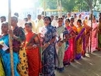 Voters stand in queue to cast their votes for the Telangana Assembly elections Voters stand in queue to cast their votes for the Telangana Assembly elections