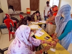 MP election results 2023: A voter gets her finger marked with indelible ink as she casts her vote for the Madhya Pradesh Assembly elections.(ANI) MP election results 2023: A voter gets her finger marked with indelible ink as she casts her vote for the Madhya Pradesh Assembly elections.(ANI)