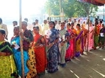 Voters stand in queue to cast their votes for the Telangana Assembly elections Voters stand in queue to cast their votes for the Telangana Assembly elections