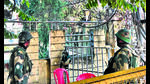 BSF personnel stand guard near houses of Kuki officials in Checkon area of Imphal. (HT Photo) BSF personnel stand guard near houses of Kuki officials in Checkon area of Imphal. (HT Photo)