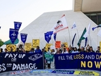 Activists hold placards and shout slogans during a protest, at the United Nations Climate Change Conference COP28 in Dubai, United Arab Emirates, on Wednesday. (REUTERS) Activists hold placards and shout slogans during a protest, at the United Nations Climate Change Conference COP28 in Dubai, United Arab Emirates, on Wednesday. (REUTERS)