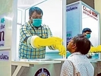 Medical staff collects samples for Covid-19 test at a walk-in kiosk in Kerala. (HT Photo) Medical staff collects samples for Covid-19 test at a walk-in kiosk in Kerala. (HT Photo)
