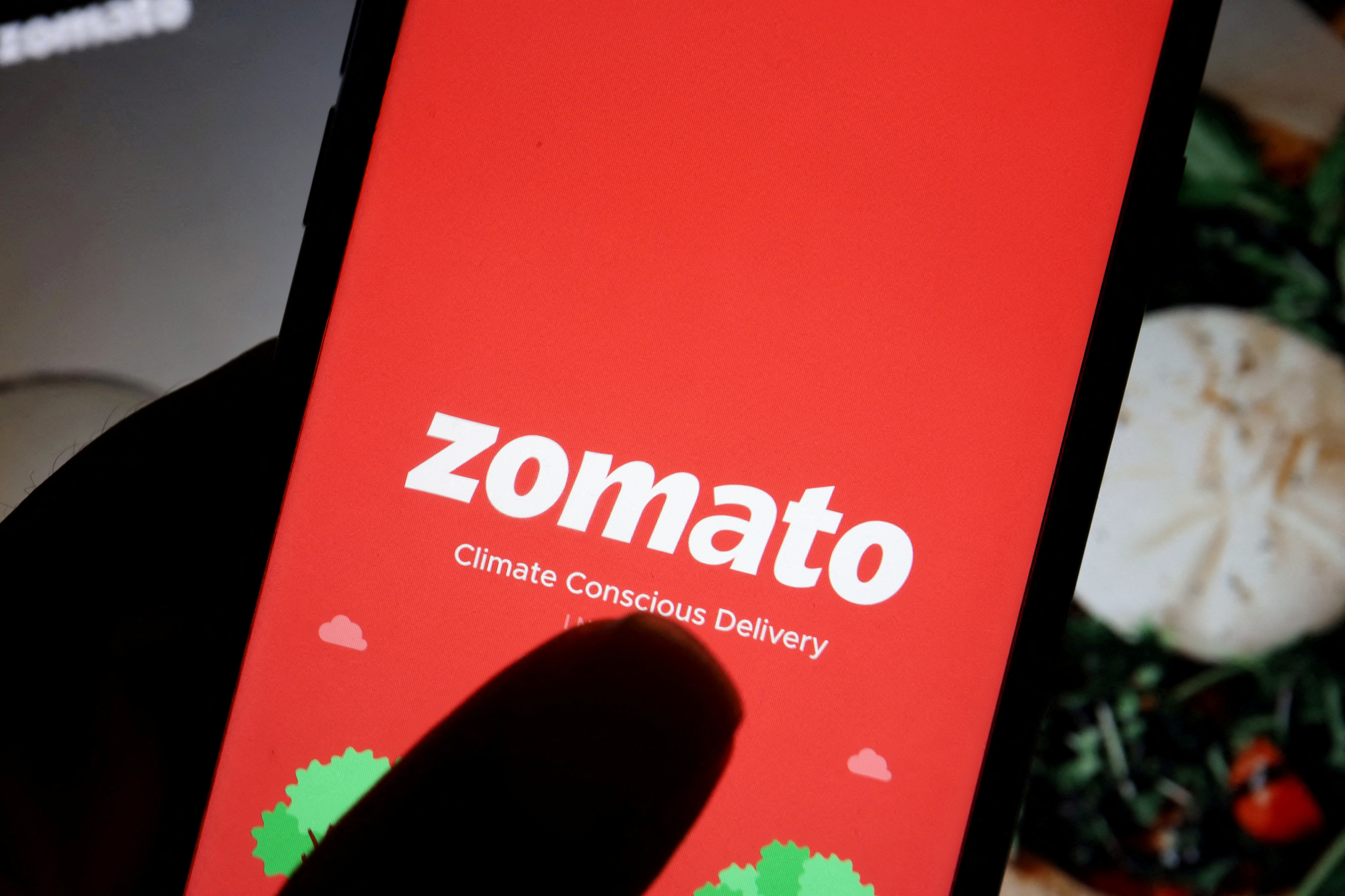 Zomato platform fee: The logo of Indian food delivery company Zomato is seen on its app on a mobile phone displayed.(Reuters)