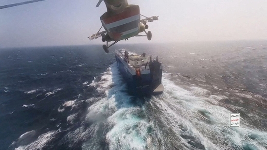 FILE PHOTO: Houthi military helicopter flies over the Galaxy Leader cargo ship in the Red Sea in this photo released November 20, 2023. Houthi Military Media/Handout via REUTERS//File Photo(via REUTERS)