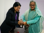A Bangladeshi polling officer puts indelible ink on the finger of Bangladesh Prime Minister Sheikh Hasina after arriving to cast her vote in Dhaka on Sunday, (AP) A Bangladeshi polling officer puts indelible ink on the finger of Bangladesh Prime Minister Sheikh Hasina after arriving to cast her vote in Dhaka on Sunday, (AP)