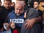 Al Jazeera's bureau chief in Gaza, Wael Al-Dahdouh (C) hugs his daughter during the funeral of his son Hamza Wael Dahdouh, a journalist with the Al Jazeera television network, who was killed in a reported Israeli air strike in Rafah in the Gaza Strip on January 7, 2024. (AFP) Al Jazeera's bureau chief in Gaza, Wael Al-Dahdouh (C) hugs his daughter during the funeral of his son Hamza Wael Dahdouh, a journalist with the Al Jazeera television network, who was killed in a reported Israeli air strike in Rafah in the Gaza Strip on January 7, 2024. (AFP)