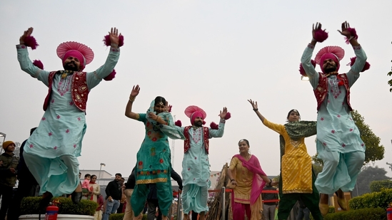 Dancers from Punjab showcase their talent during Lohri celebrations at Great India Place Mall in sector 38A.(Sunil Ghosh/HT Photo)