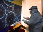 An illustration of the novel coronavirus seen next to a health care worker at a Covid-19 testing centre in New Delhi(HT) An illustration of the novel coronavirus seen next to a health care worker at a Covid-19 testing centre in New Delhi(HT)
