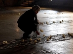 A woman places a flower at the Hall of Remembrance where the names of major killing sites of Jews are written during a Holocaust Remembrance Day ceremony at the Yad Vashem Holocaust Museum in Jerusalem.(AFP File Photo) A woman places a flower at the Hall of Remembrance where the names of major killing sites of Jews are written during a Holocaust Remembrance Day ceremony at the Yad Vashem Holocaust Museum in Jerusalem.(AFP File Photo)