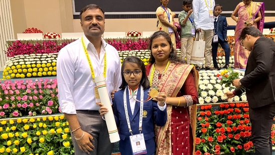Charvi Anilkumar, along with her parents, after receiving the Bal Rashtriya Puraskar Charvi Anilkumar, along with her parents, after receiving the Bal Rashtriya Puraskar