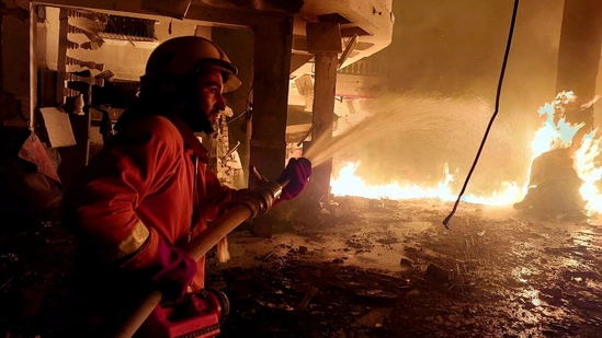 A member of the Palestinian Civil Defence works at the site of Israeli strikes, amid the ongoing conflict between Israel and Hamas in Rafah. (Reuters)