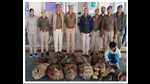 The two turtle smuggles in police custody. (HT) The two turtle smuggles in police custody. (HT)