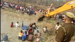 Rescue operation underway at the pond where at least 23 people, including eight children, died when their tractor-trolley overturned and fell in Kasganj of Uttar Pradesh on Saturday. (PTI) Rescue operation underway at the pond where at least 23 people, including eight children, died when their tractor-trolley overturned and fell in Kasganj of Uttar Pradesh on Saturday. (PTI)