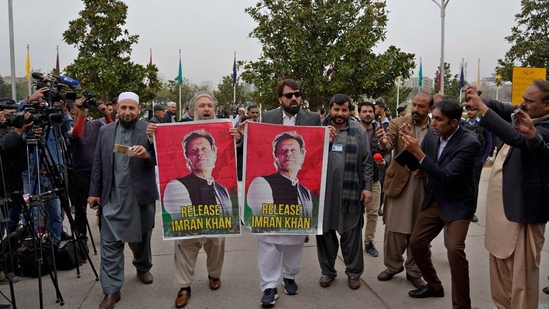 Pakistan's newly elected lawmakers displays a poster of their leader and imprisoned former Prime Minister Imran Khan as they arrive to attend opening session of the Parliament, in Islamabad, Pakistan. (AP) Pakistan's newly elected lawmakers displays a poster of their leader and imprisoned former Prime Minister Imran Khan as they arrive to attend opening session of the Parliament, in Islamabad, Pakistan. (AP)