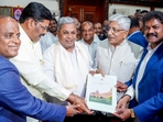 Karnataka State Permanent Backward Classes Commission chairman K Jayaprakash Hegde submitted a voluminous report on the caste survey to CM Siddaramaiah on Thursday. (ANI) Karnataka State Permanent Backward Classes Commission chairman K Jayaprakash Hegde submitted a voluminous report on the caste survey to CM Siddaramaiah on Thursday. (ANI)