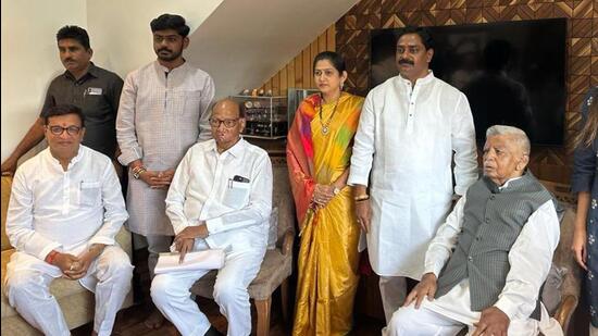 Sharad Pawar with ex-MLA Anantrao Thopte (sitting on right) and his son Sangram Thopte (standing next to father). (HT) Sharad Pawar with ex-MLA Anantrao Thopte (sitting on right) and his son Sangram Thopte (standing next to father). (HT)