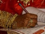 A bride signs the nikah nama during Muslim marriage ceremony. (Representative Photo)(HT Photo) A bride signs the nikah nama during Muslim marriage ceremony. (Representative Photo)(HT Photo)