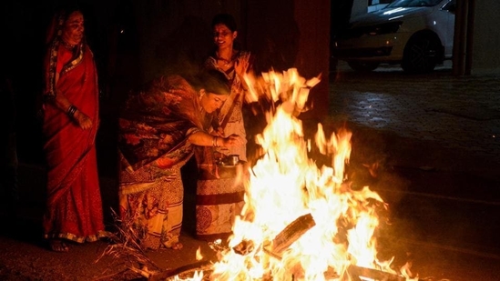 Holika Dahan also Kamudu pyre is celebrated by burning Holika, the devil. (Milind Saurkar/HT Photo)