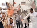 BJP workers burn Arvind Kejriwal's effigies in Delhi on the eve of Holi (Twitter) BJP workers burn Arvind Kejriwal's effigies in Delhi on the eve of Holi (Twitter)