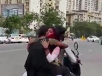 Two girls sitting facing each other on a two-wheeler driven by a boy as seen in this video. Two girls sitting facing each other on a two-wheeler driven by a boy as seen in this video.