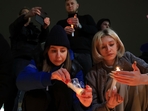 People light candles in memory of the victims of the terrorist attack in Moscow, in the center of in the center of Simferopol, in Russian-held Crimea on Friday.(AP) People light candles in memory of the victims of the terrorist attack in Moscow, in the center of in the center of Simferopol, in Russian-held Crimea on Friday.(AP)