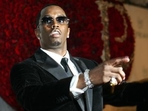 This November 4, 2004, file photo shows Sean ‘P. Diddy’ Combs directing photographers as they sing This November 4, 2004, file photo shows Sean ‘P. Diddy’ Combs directing photographers as they sing