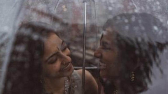File photo shows Anjali Chakra from India and Sundas Malik from Pakistan under a rain-splattered umbrella. (Twitter/@Sarowarrrr) File photo shows Anjali Chakra from India and Sundas Malik from Pakistan under a rain-splattered umbrella. (Twitter/@Sarowarrrr)
