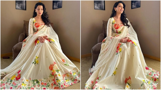 Nora Fatehi is a total stunner who nails fashion like a pro. Whether it's a sartorial saree or a chic jumpsuit, the actress can pull off any look to perfection. The stylish diva is currently showcasing her love for ethnic wear and her back to back glamorous looks are sure to inspire your ethnic wardrobe. Just a day ago, she wowed her fans in a stunning pink kurta ensemble and this time around, she is turning heads in a mesmerising ivory anarkali suit adorned with an enchanting floral pattern. Let's decode her chic look and take some style notes. (Instagram/@norafatehi)