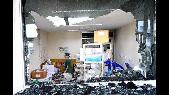 Staff had to break open the glass windows to let the smoke out following the blaze on Saturday. (RAVI KUMAR/HT) Staff had to break open the glass windows to let the smoke out following the blaze on Saturday. (RAVI KUMAR/HT)